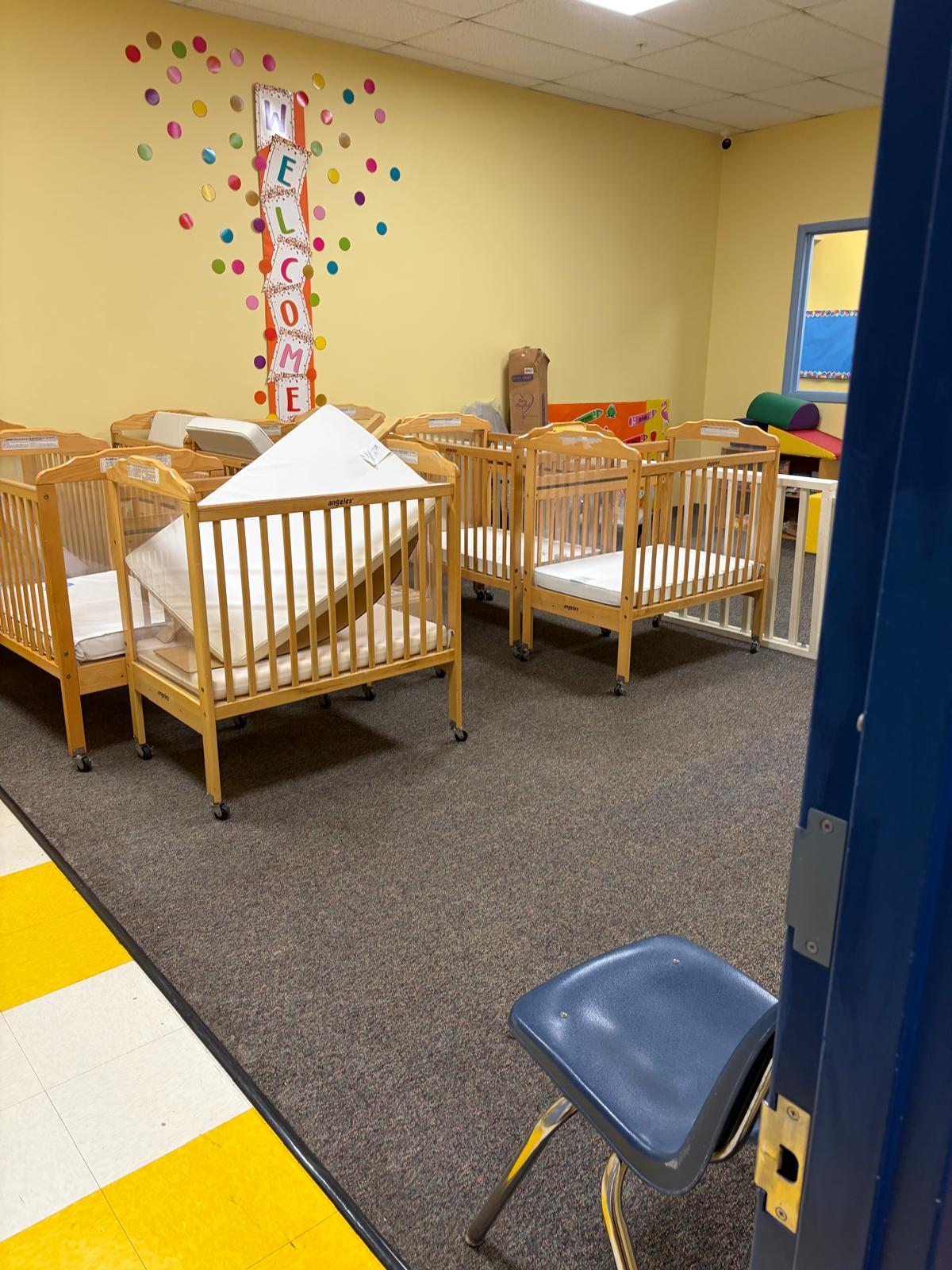 Infant room with cribs and safe sleep environment
